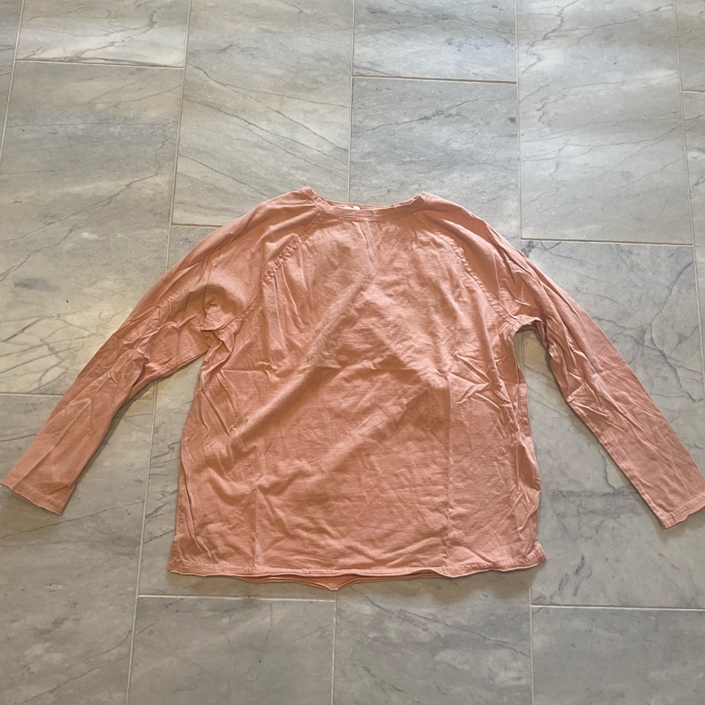Light peach shirt with stars. Size S.